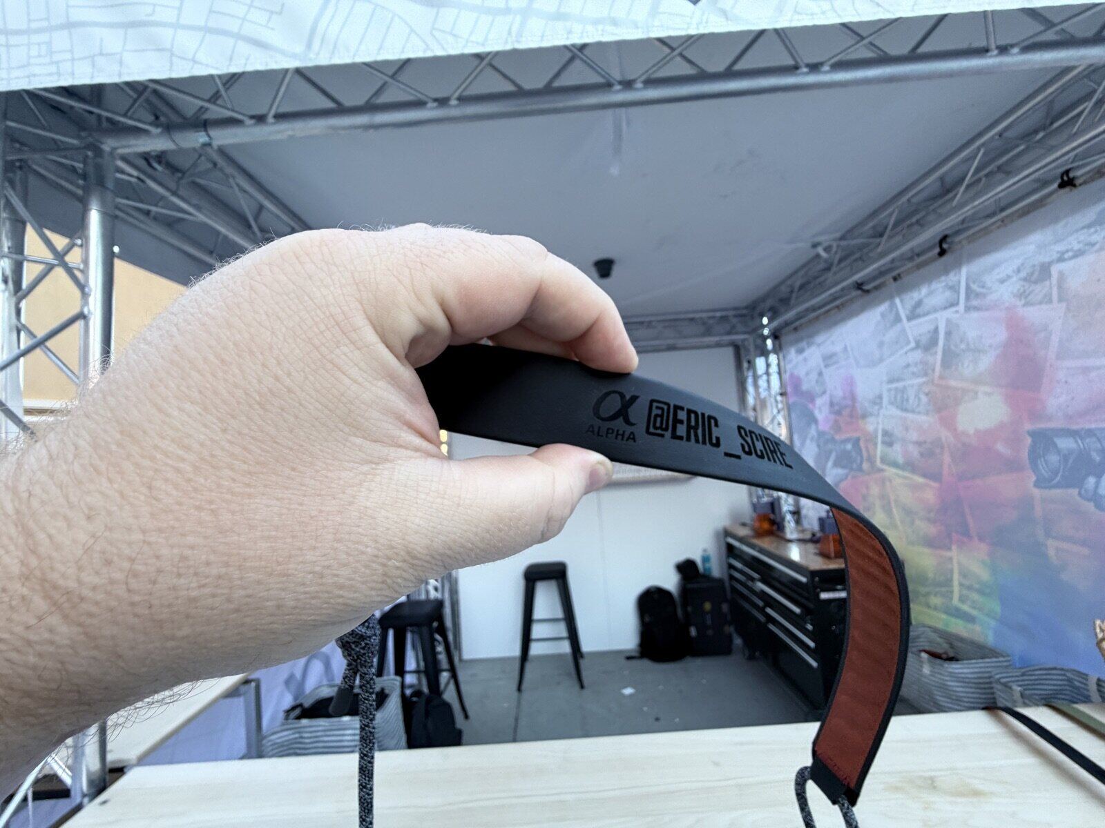 Laser engraving station running custom pieces at a live event activation
