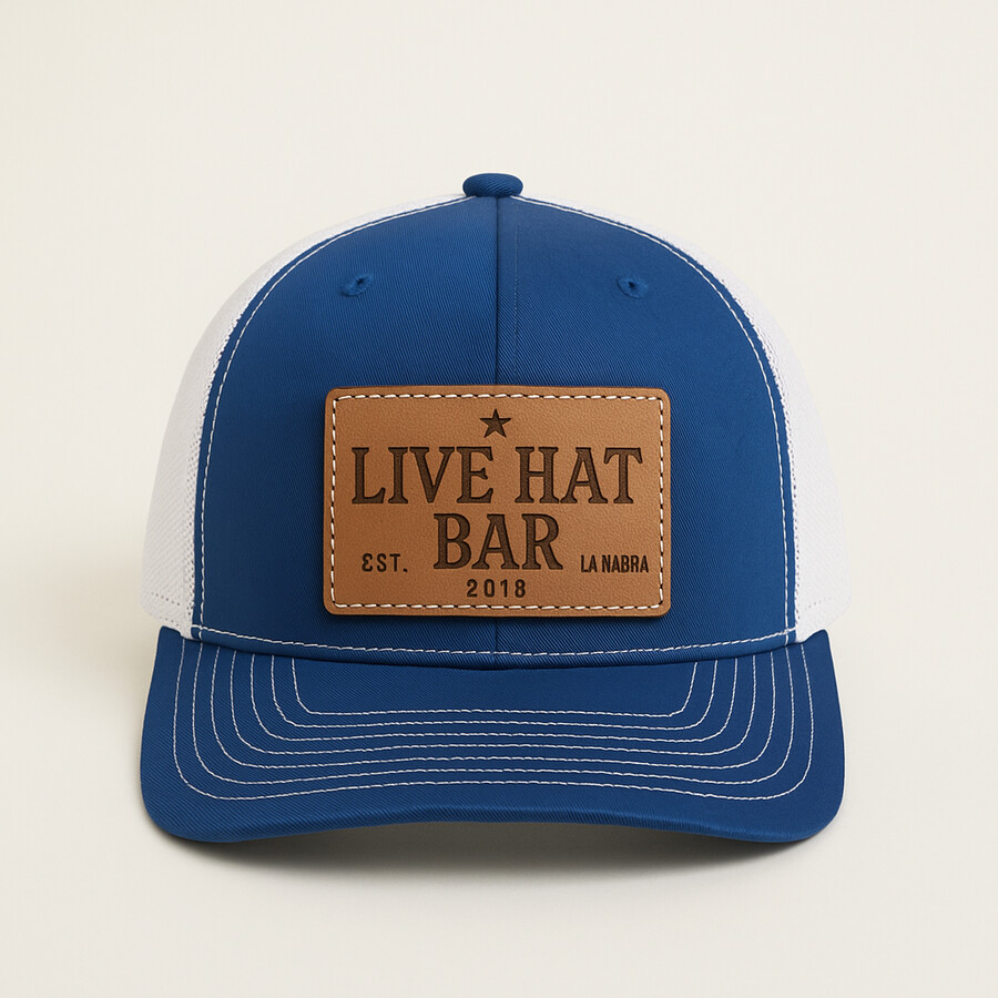 Royal trucker snapback finished with an engraved leather hat bar patch